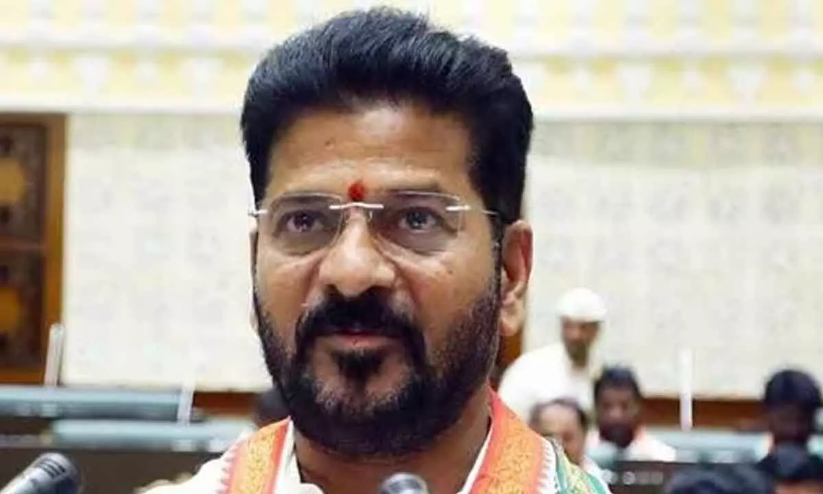 Revanth Reddy challenges BRS for probe on distribution of sheeps and bathukamma sarees