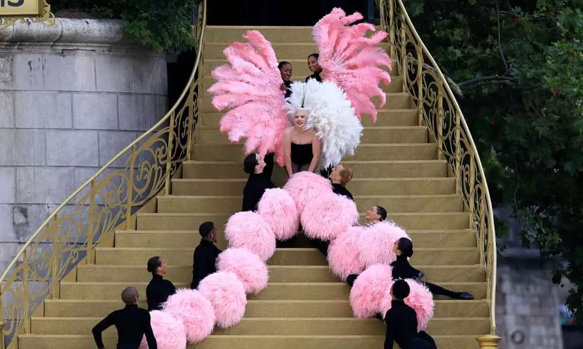 Lady Gaga Dazzles at the 2024 Olympics with a Bubblegum Pink Feathered Spectacle and Dior Ensemble