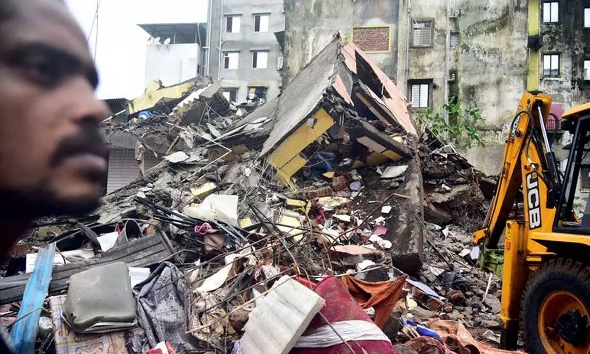 2 rescued from rubble, 3 dead in building collapse