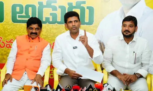 Union Minister of State for Rural Development and Communications Dr Pemmasani Chandrasekhar addressing media at his residence in Guntur on Sunday. MLA Md Naseer Ahmed, BJP state media cell in-charge Paturi Nagabhushanam are also seen