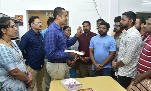 Collector A Shyam Prasad interacting with job aspirants at Vignana Vikasa Kendram inaugurated in Parvathipuram on Monday