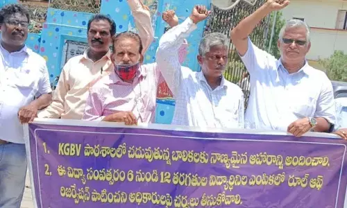 Representatives of people’s organisations stage a protest seeking action over poor quality food in KGBVs, at zilla parishad office in Srikakulam on Monday