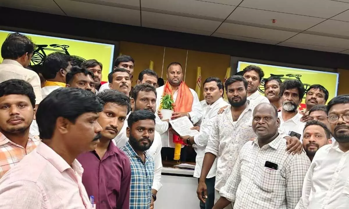 RTC outsourced employees submit a memorandum with their demands to transport minister M Ramprasad Reddy at Mangalagiri on Tuesday