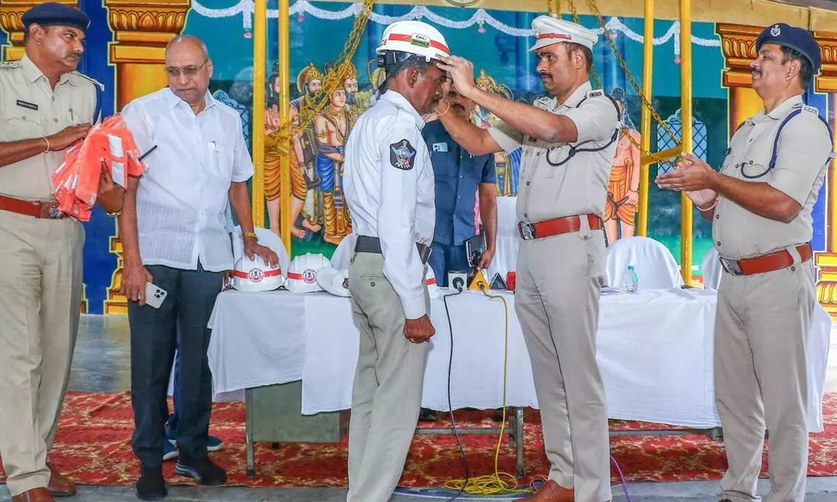 SP L Subbarayudu providing protective gear to the traffic police in Tirupati on Tuesday