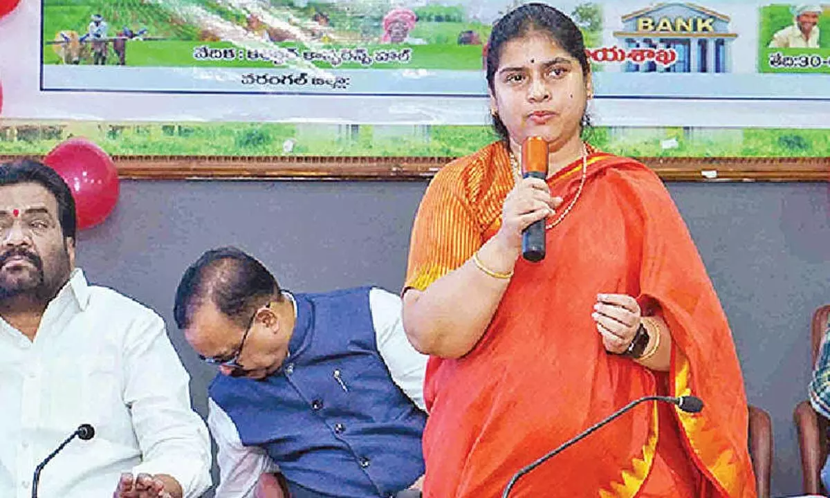 Warangal district collector Satya Sarada Devi speaking at the crop loan waiver programme in Hanumakonda on Tuesday. TSCAB chairman Marneni Ravinder Rao is also seen