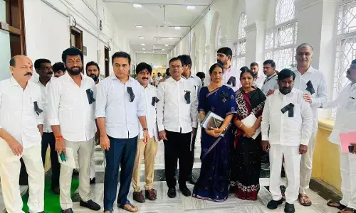 BRS MLAs arrives in Assembly with black badges in protest against CM comments