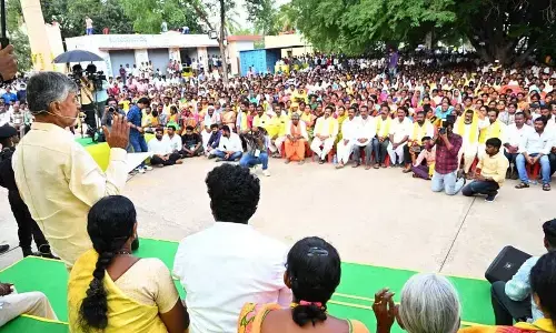 Chief Minister N Chandrababu Naidu addressing a village meeting after distributing pensions at Gundumala in Sri Satyasai district