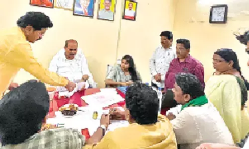 Minister Kolusu Parthasarathy convening a review meeting with marketing officials and traders in Nuzvid on Thursday