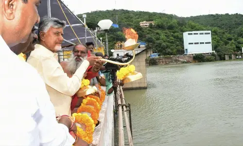 Chief Minister N Chandrababu Naidu offering Jala Harati to River Krishna at Srisailam on Thursday