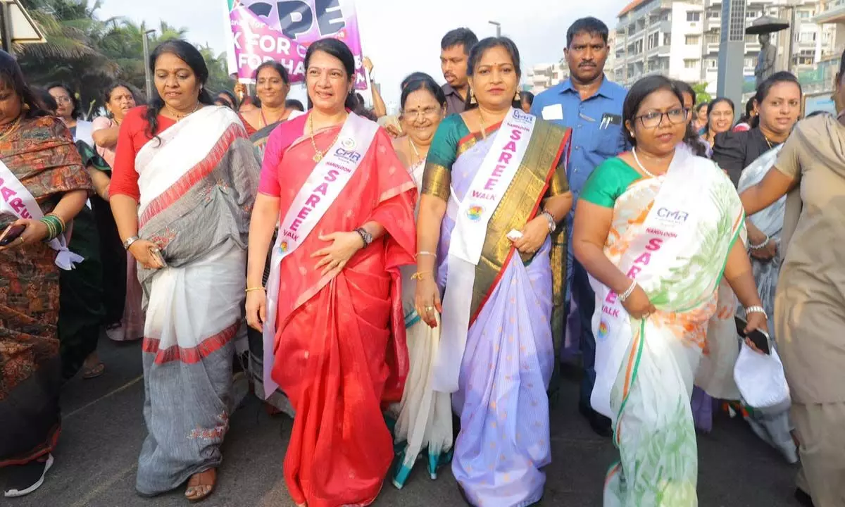 Home Minister takes part in a saree walk