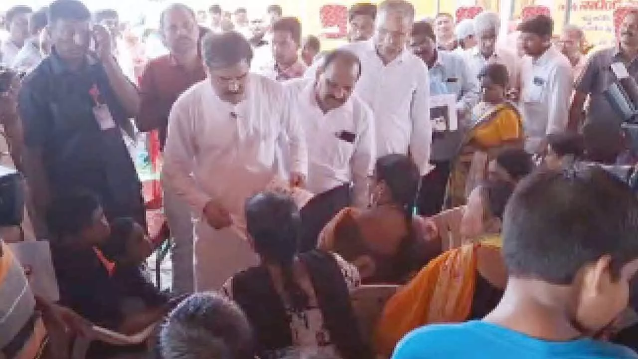 Minister Nadendla Manohar interacting with the housing beneficiaries at Pedaravuru on Sunday