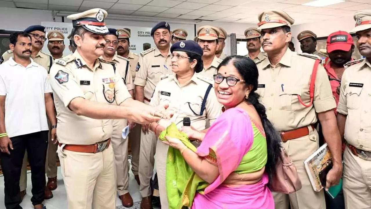 Police Commissioner Shanka Brata Bagchi handing over recovered property to a complainant in Visakhapatnam on Sunday