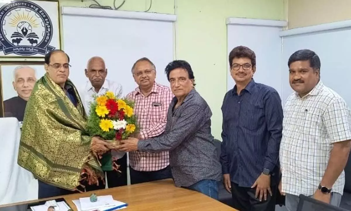 Members of the management committee of Indira Priyadarsini Law College in Ongole felicitating AKU V-C Prof DVR Murthy in his chamber at AKU Ongole on Monday