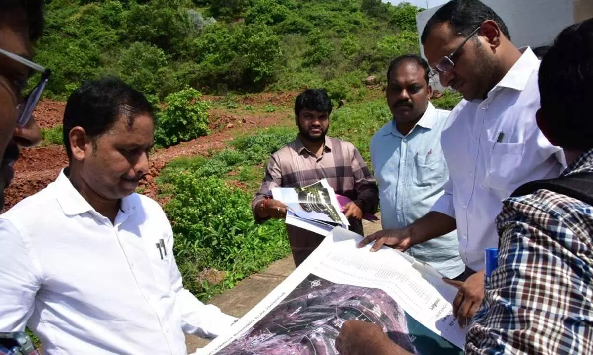 District collector M N Harendhira Prasad examining the houses being constructed at Anandapuram mandal in Visakhapatnam  on Monday