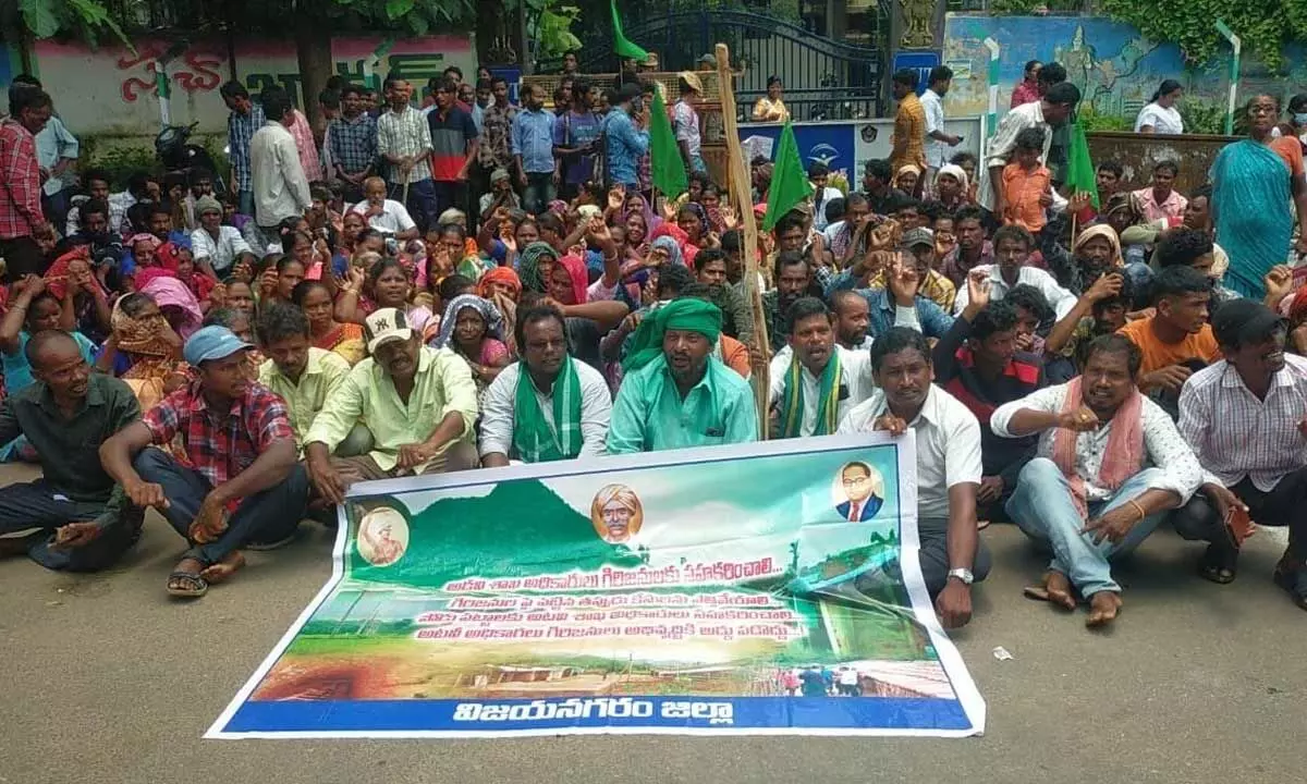 Adivasis staging a dharna at the collectorate demanding title deeds to forest lands at Vizianagaram collectorate on Monday