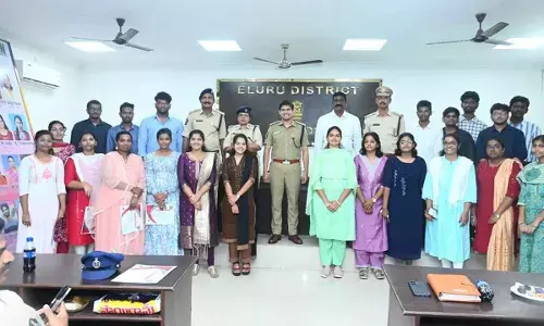 SP K Pratap Siva Kishore with students who received prizes and certificates in Eluru on Sunday