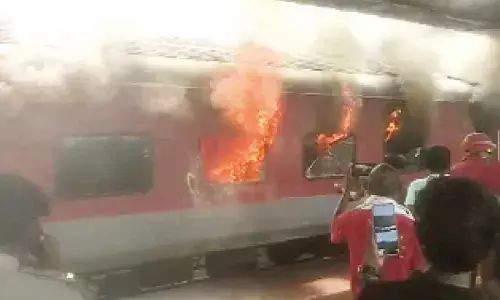 Empty coach of a train which caught fire at Visakhapatnam railway station on Sunday morning