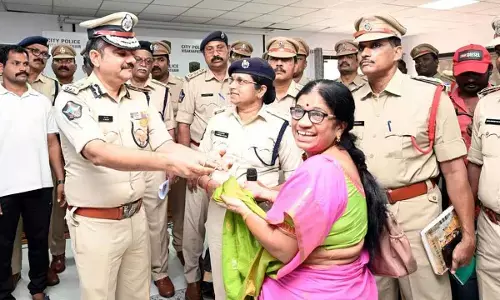 Police Commissioner Shanka Brata Bagchi handing over recovered property to a complainant in Visakhapatnam on Sunday