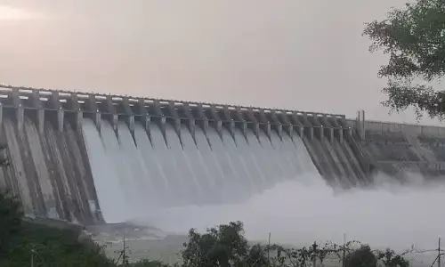 Floodwater gushing out from Nagarjuna Sagar reservoir in Guntur district on Monday