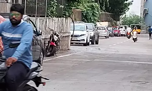 Vehicles illegally parked on the road in Tirupati