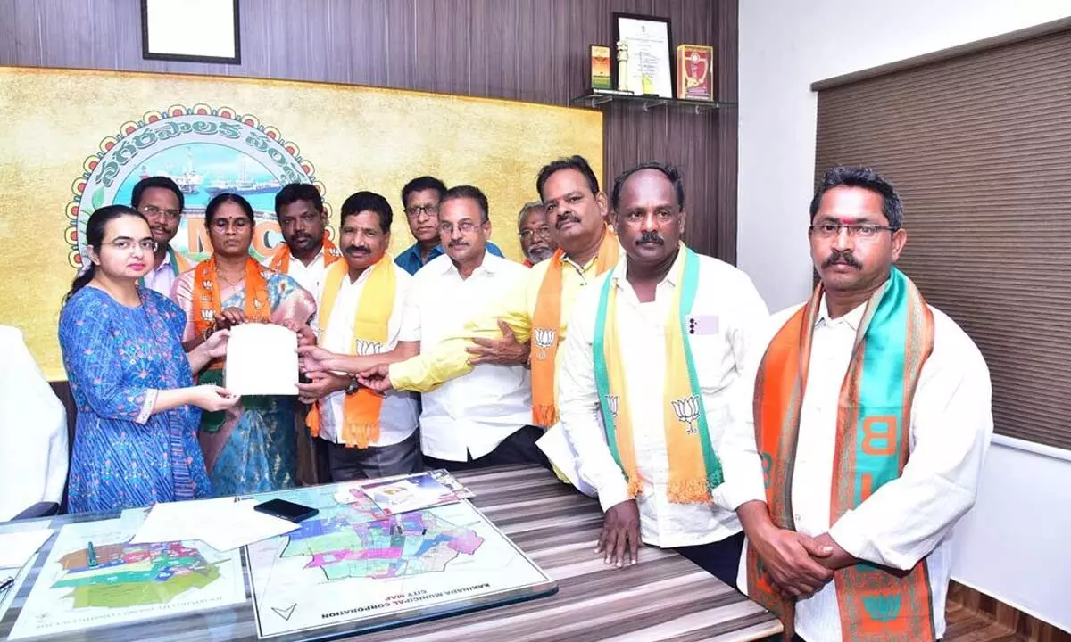 BJP leaders meeting city municipal commissioner Bhavana Vasishta to hand over a petition on civic problems of Kakinada recently