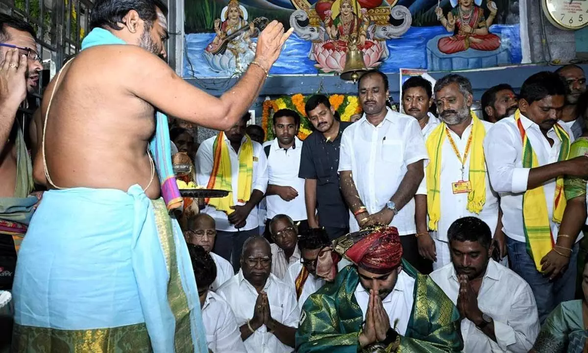 Minister Nara Lokesh performing special pujas at Kanaka Puttalamma temple at Pedakonduru on Tuesday