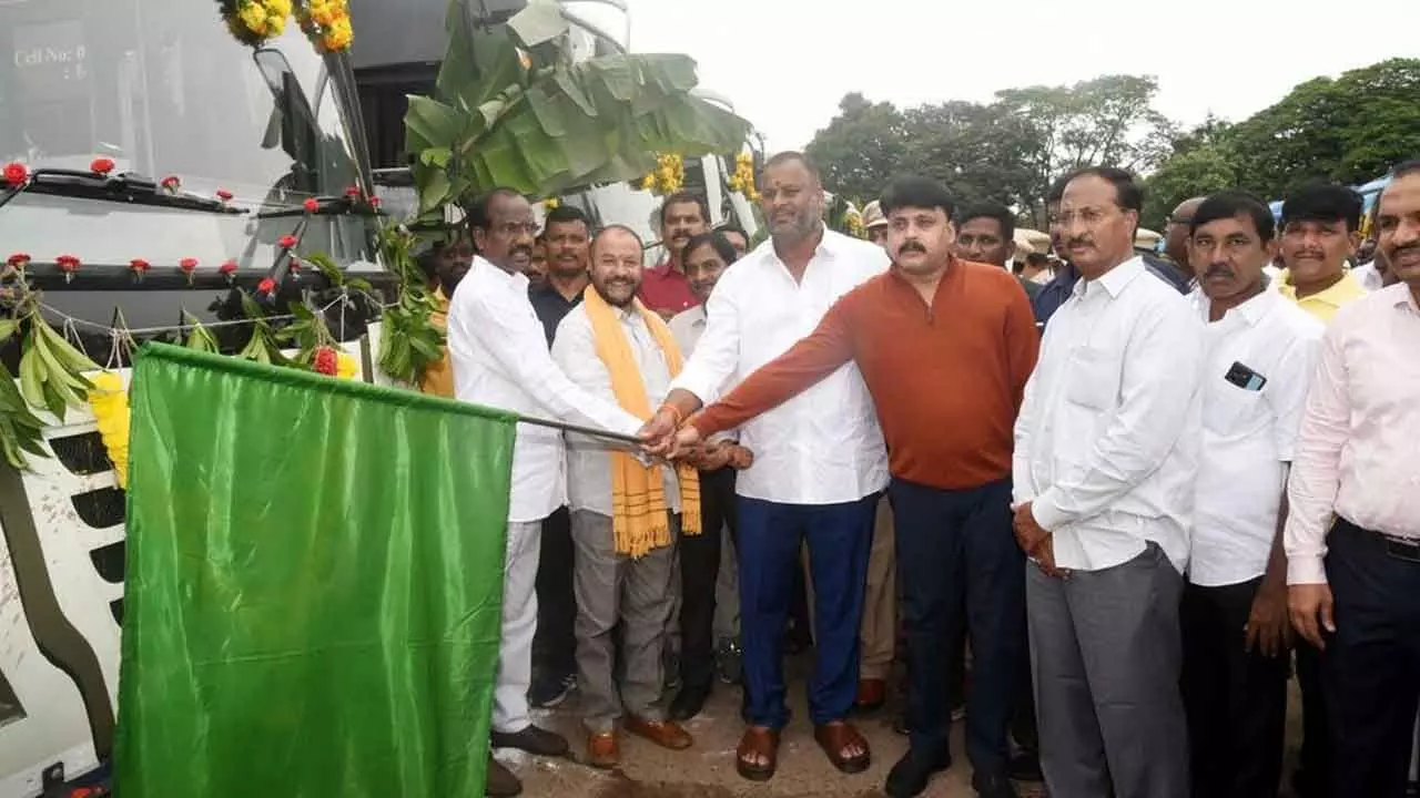 Minister for transport, youth welfare and sports Mandipalli Ram Prasad Reddy flagging off RTC buses at Eluru bus depot on Thursday