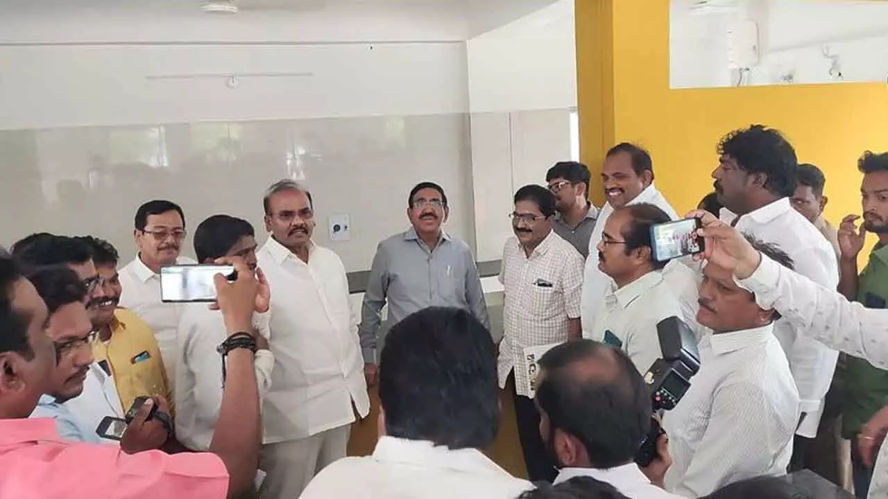 Minister for Municipal Administration P Narayana and MLA Prathipati Pulla Rao examining Anna Canteen building in Chilakaluripet on Thursday