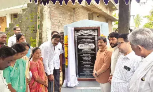 Minister Kandula Durgesh and others laying foundation stones of various internal roads on Thursday