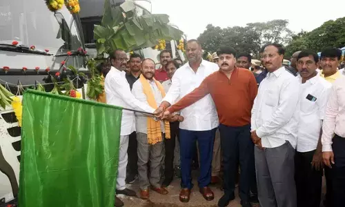 Minister for transport, youth welfare and sports Mandipalli Ram Prasad Reddy flagging off RTC buses at Eluru bus depot on Thursday