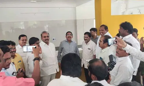 Minister for Municipal Administration P Narayana and MLA Prathipati Pulla Rao examining Anna Canteen building in Chilakaluripet on Thursday