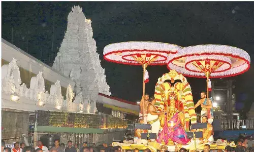 Lord blesses devotees from atop Garuda Vahanam