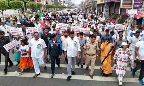 Awareness Walk Against Cyber Crimes Held in Vijayawada, Home Minister participates