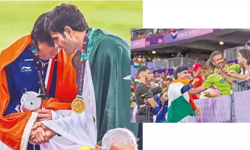 Gold medalist Indias Neeraj Chopra with bronze medalist Pakistans Arshad Nadeem at the medal ceremony of the mens javelin throw event during the 18th Asian Games 2018, in Jakarta, Indonesia.; Silver medalist Indias Neeraj Chopra being congratulated by a Pakistani fan in Paris, France on Thursday.