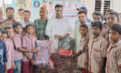 MLA Adluri Laxman distributes mattresses to students