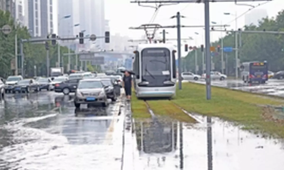 Flood-disrupted railway resumes traffic in China