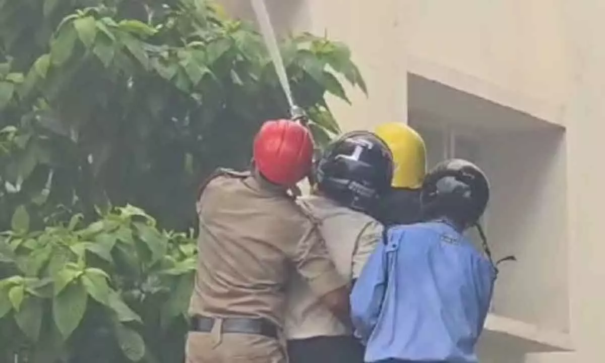 The fire fighters bringing down the situation under control at a hospital in Visakhapatnam on Sunday