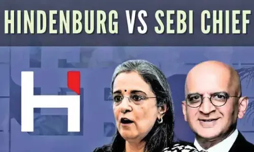 Come clean on stake in Adanis fund while in office