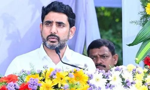 Minister for HRD and IT Nara Lokesh addressing a meeting held at the Police Parade Grounds in Guntur on Thursday