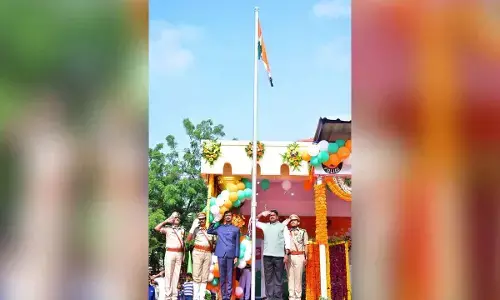 Finance Minister Payyavula Keshav, district Collector Dr V Vinod Kumar and others hoisting the national flag in Anantapur on Thursday