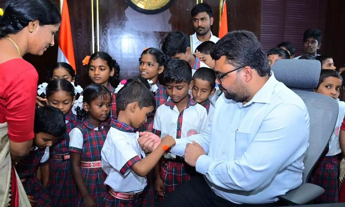 Children Tie Rakhis to Collector Badawat Santosh