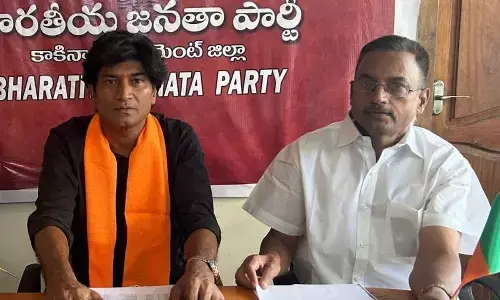 BJP district president Chilukuri Ram Kumar and Media Panelist Duvvuri Subrahmanyam speaking at a media conference in Kakinada on Sunday