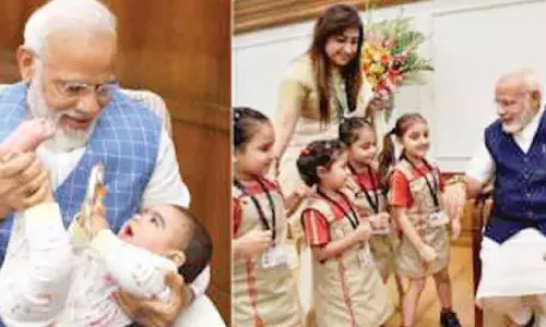 Children share heart-warming moment with PM Modi