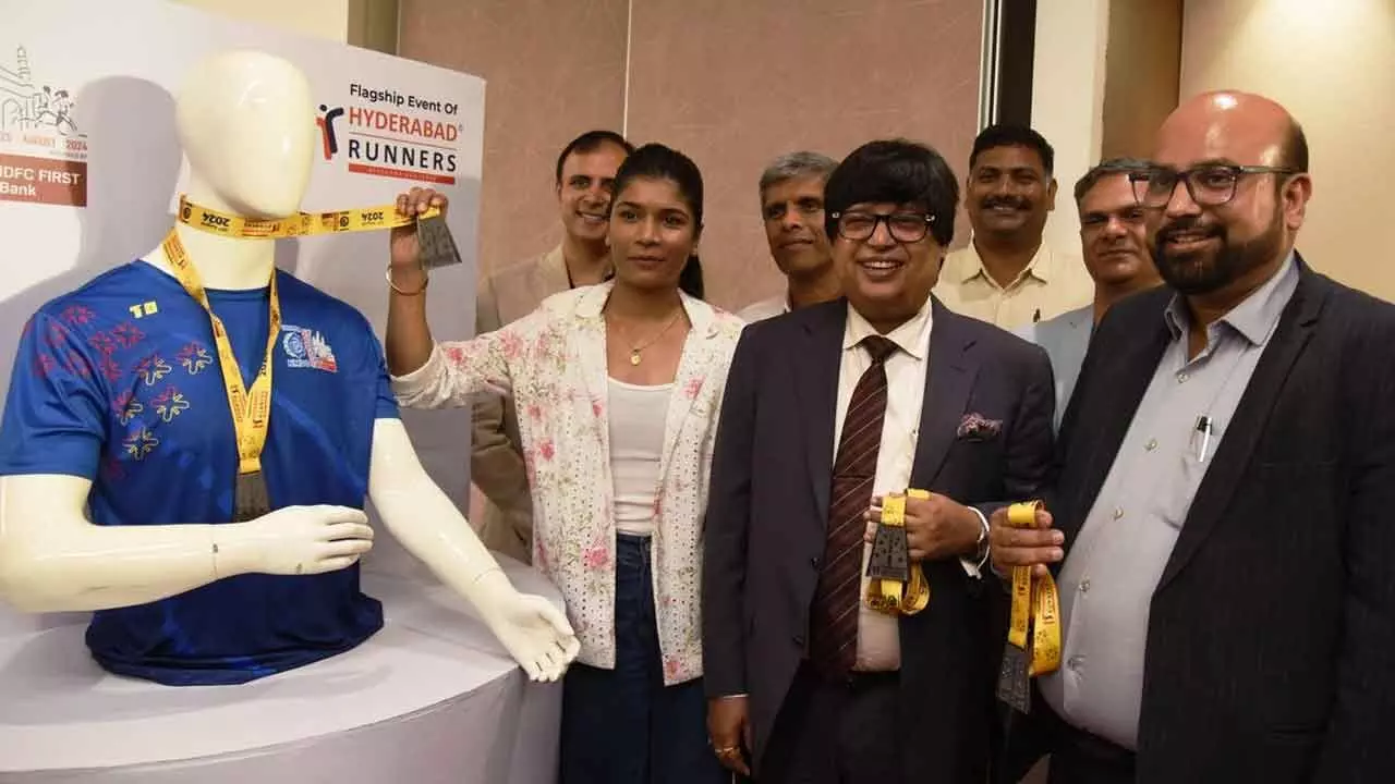 The finishers medal and T-Shirt being unveiled for the flagship event of Hyderabad Runners here on Tuesday  (Photo:  Adula Krishna)