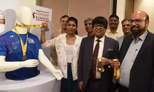 The finishers medal and T-Shirt being unveiled for the flagship event of Hyderabad Runners here on Tuesday  (Photo:  Adula Krishna)