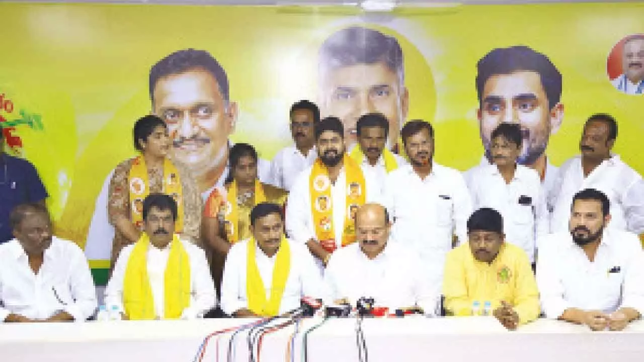 Vijayawada MP Kesineni Sivanath and other TDP leaders with the three YSRCP corporators, who joined the TDP in Vijayawada on Thursday