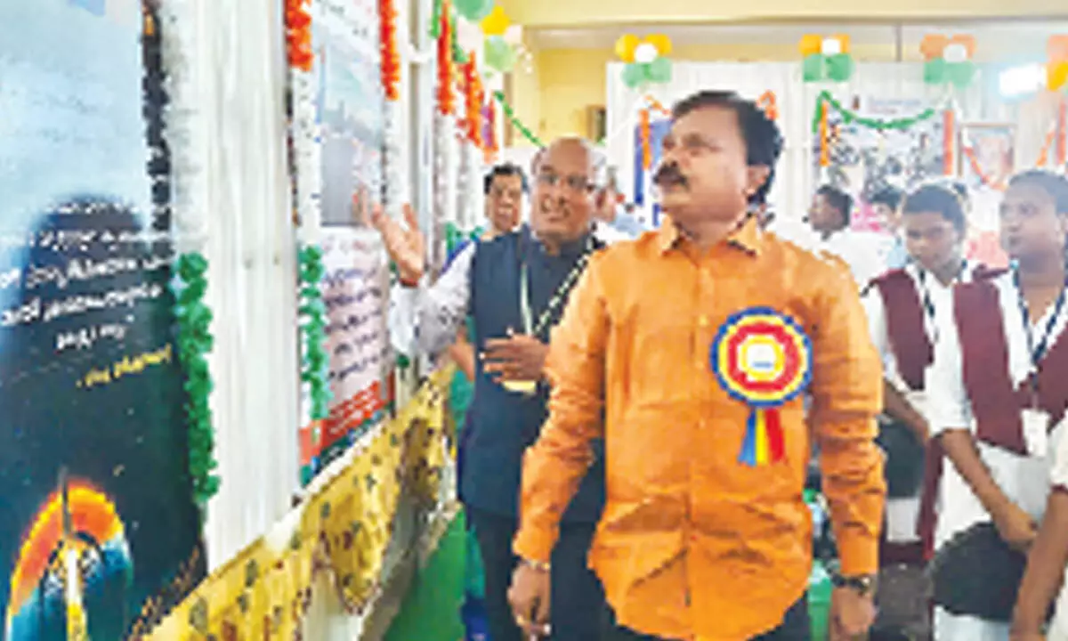 Gudur MLA Pashim Sunil Kumar watching the photo  exhibition on Friday