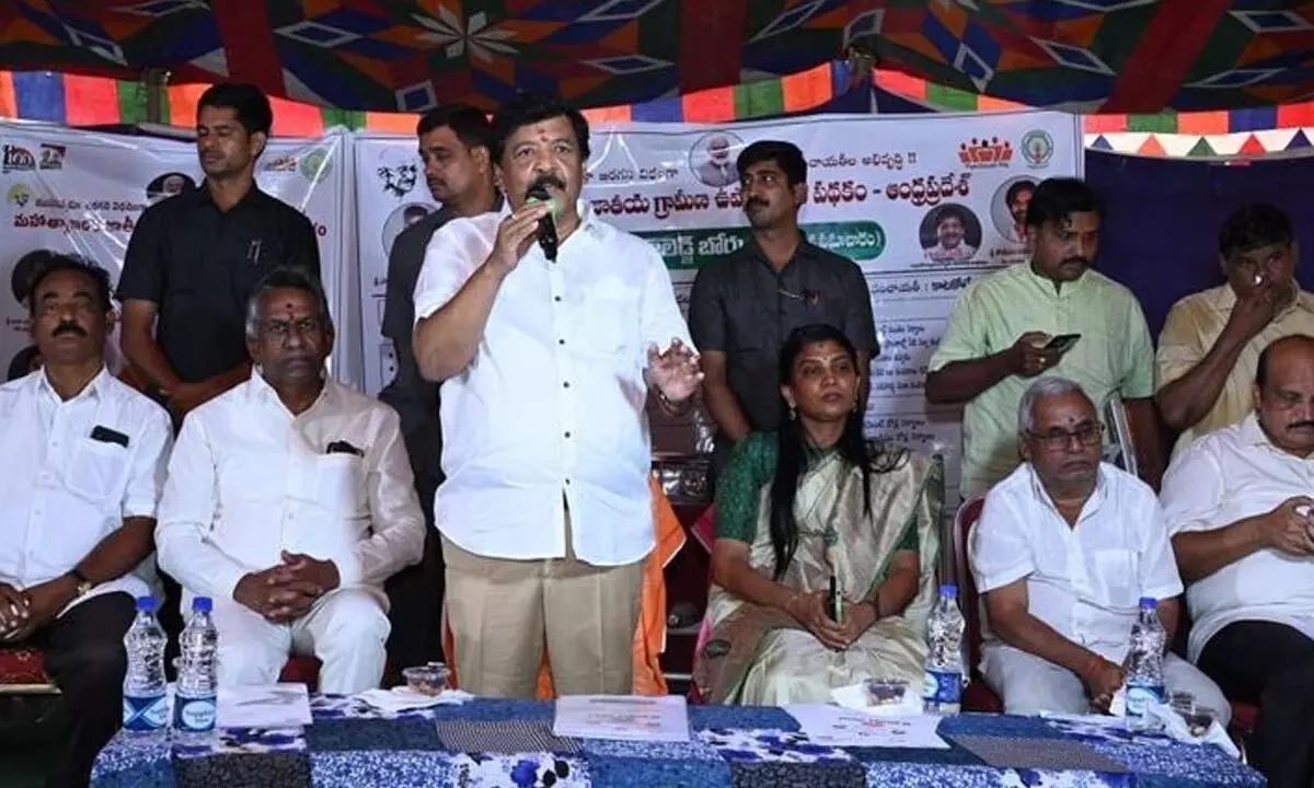 Minister Kandula Durgesh speaking at a Gram Sabhas in Kata Koteswaram village on Friday. Collector P Prasanthi and former MLA Burugupalli Sesha Rao are also seen