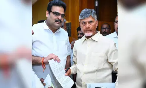 AP BJP chief official spokesperson Lanka Dinakar submitting Prakasam district development master plan to Chief Minister  N Chandrababu Naidu