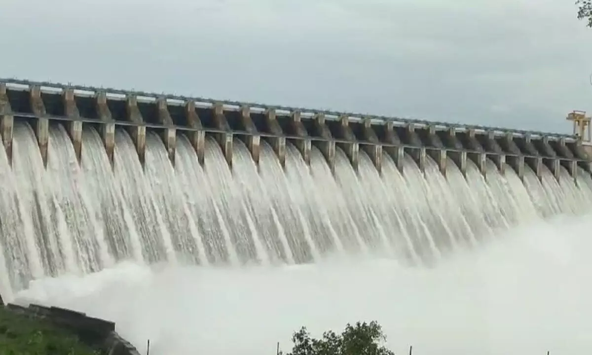 Floodwater gushing out from Nagarjuna Sagar reservoir in Palnadu district on Sunday